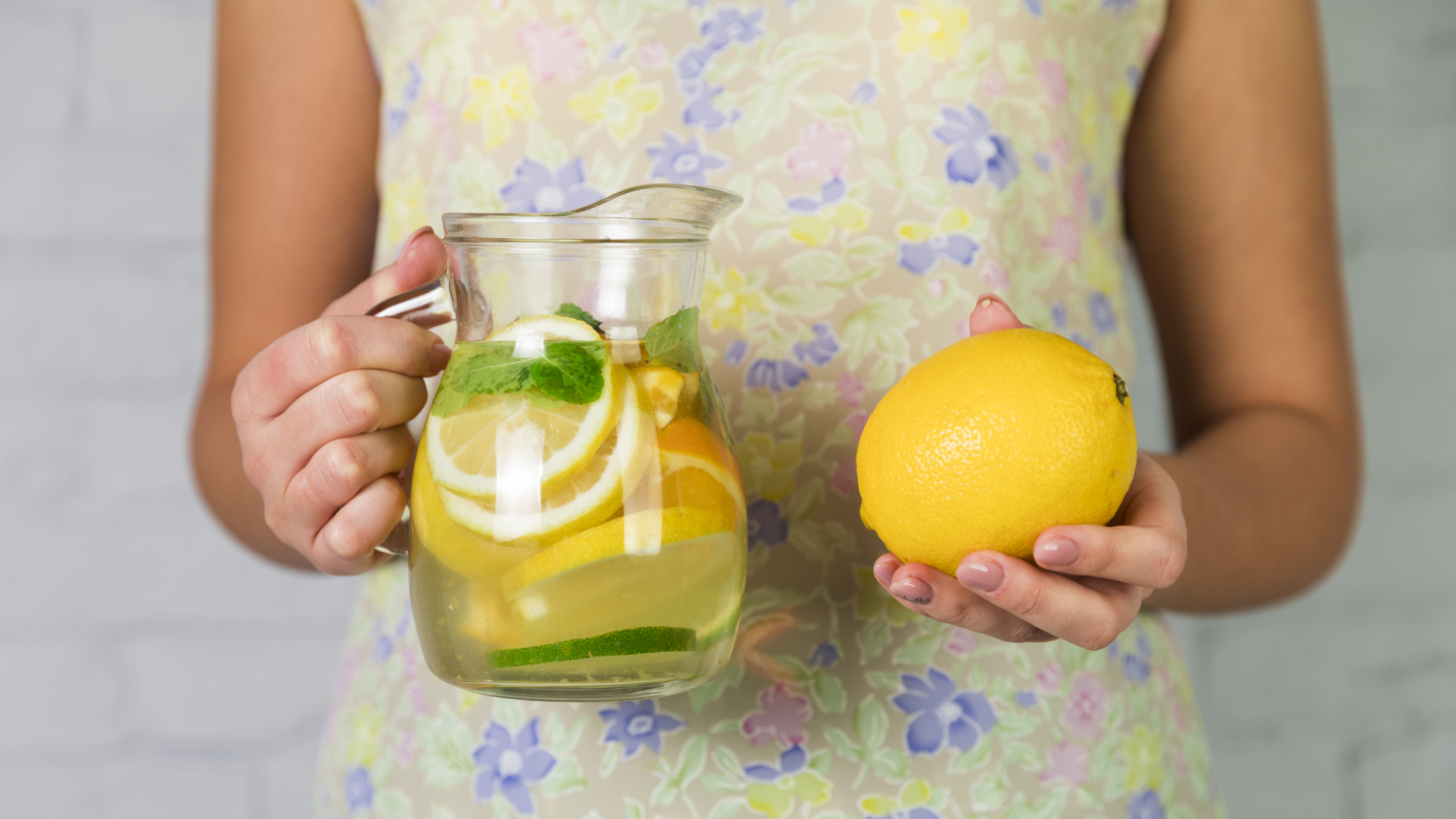 homemade-lemonade-lemon-held-by-woman.jpg