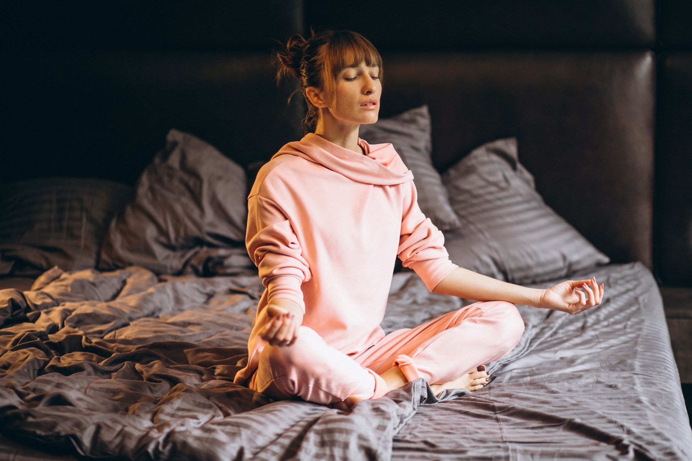 woman-doing-yoga-in-bed.jpg