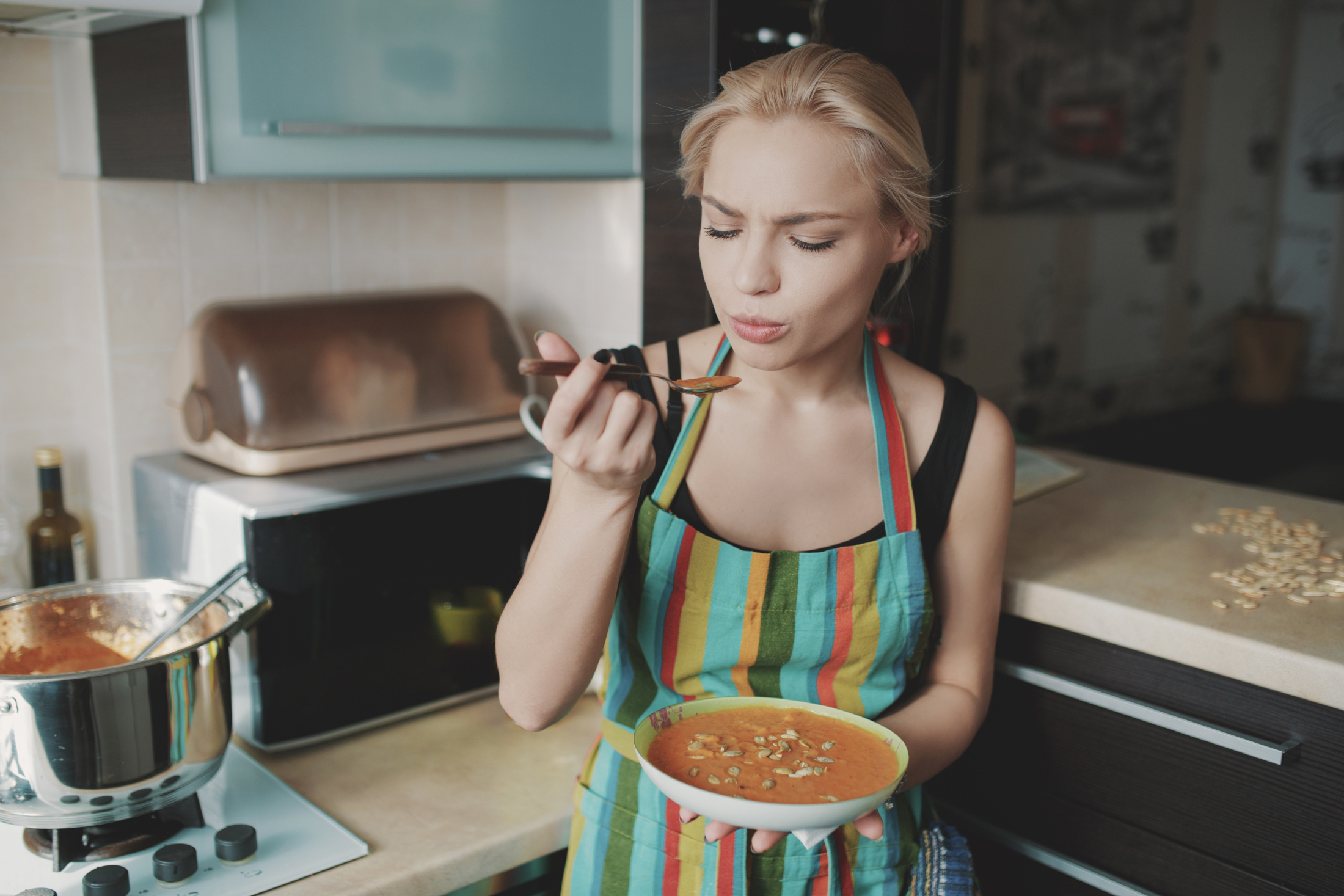 young-woman-enjoying-pumpkin-soup.jpg
