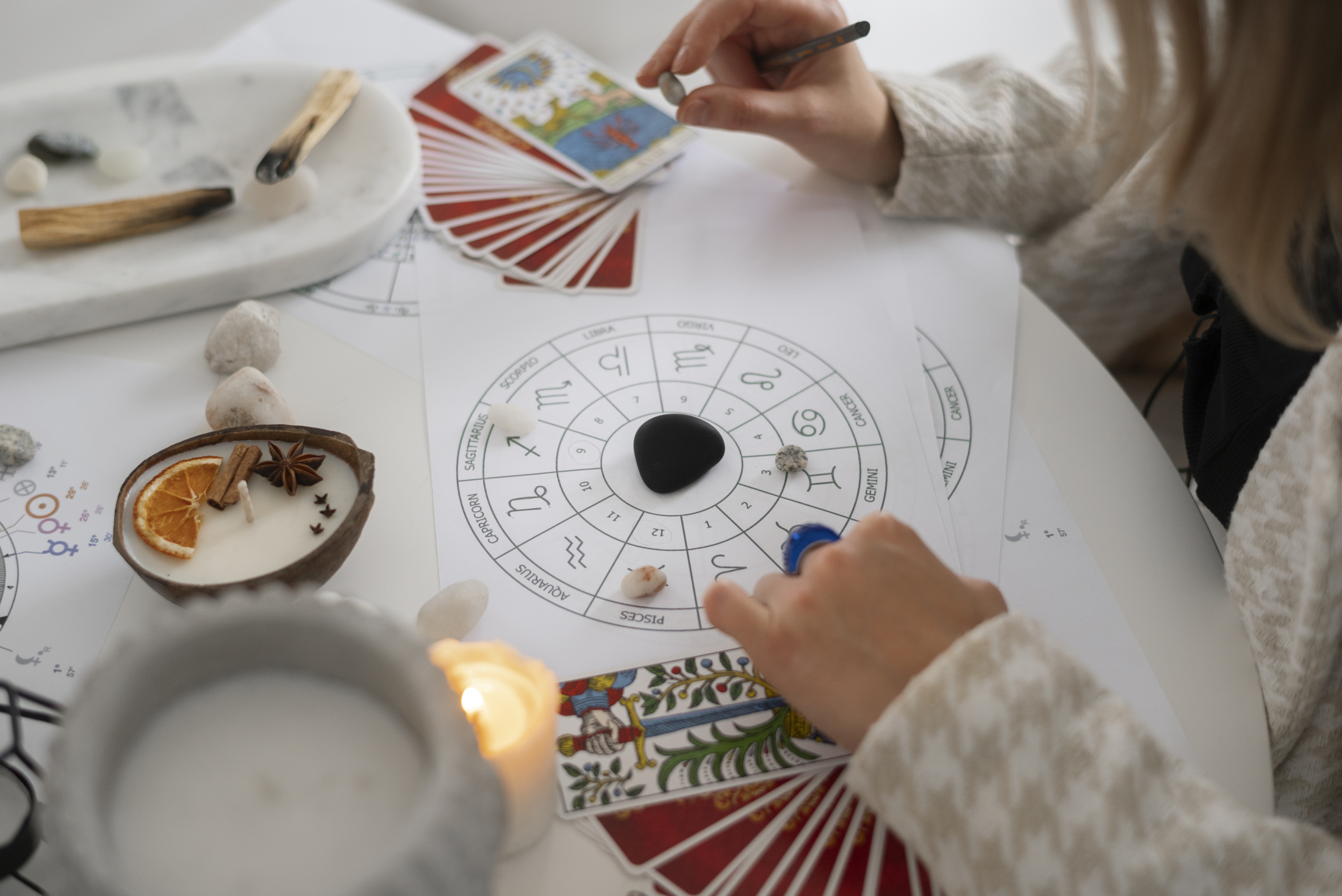 high-angle-woman-reading-tarot-home.jpg