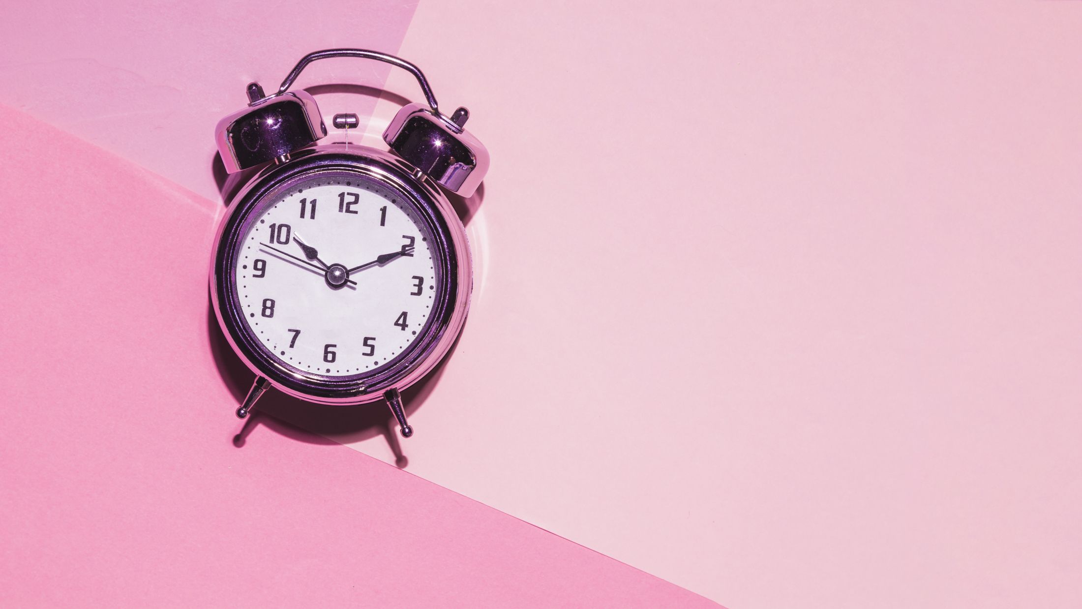 top-view-clock-on-pink-background.jpg