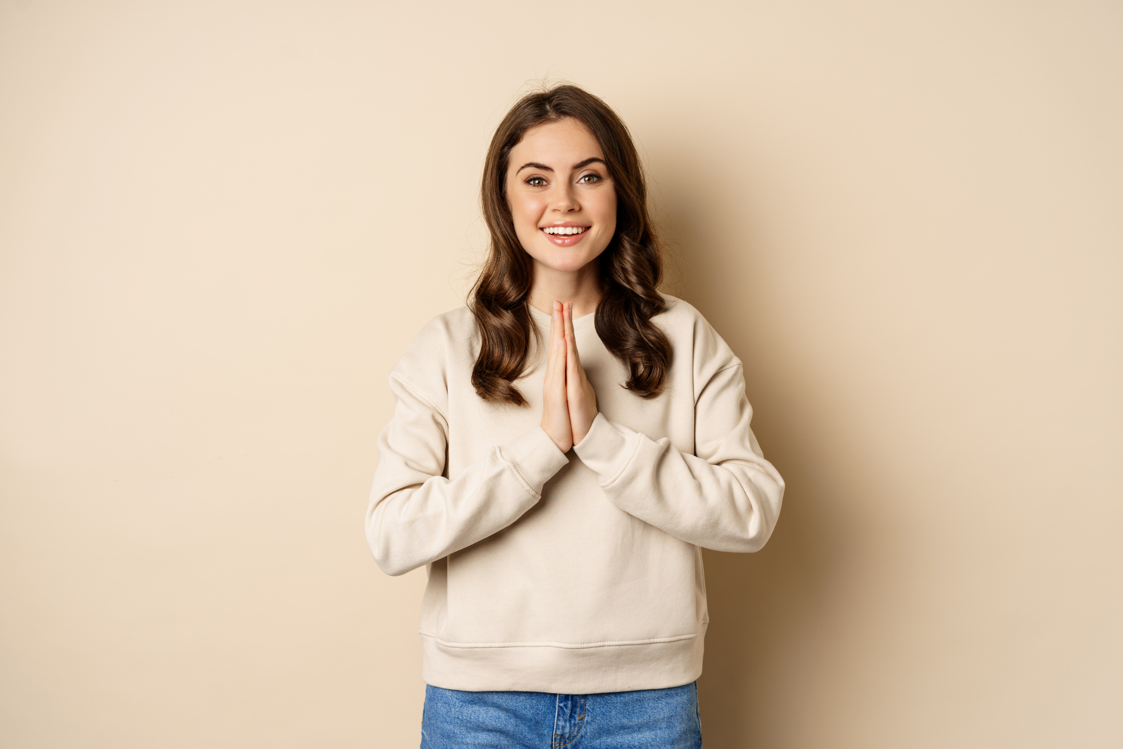 thank-you-smiling-happy-woman-showing-pray-namaste-gesture-thanking-standing-pleased-and-grateful-over-beige-background.jpg