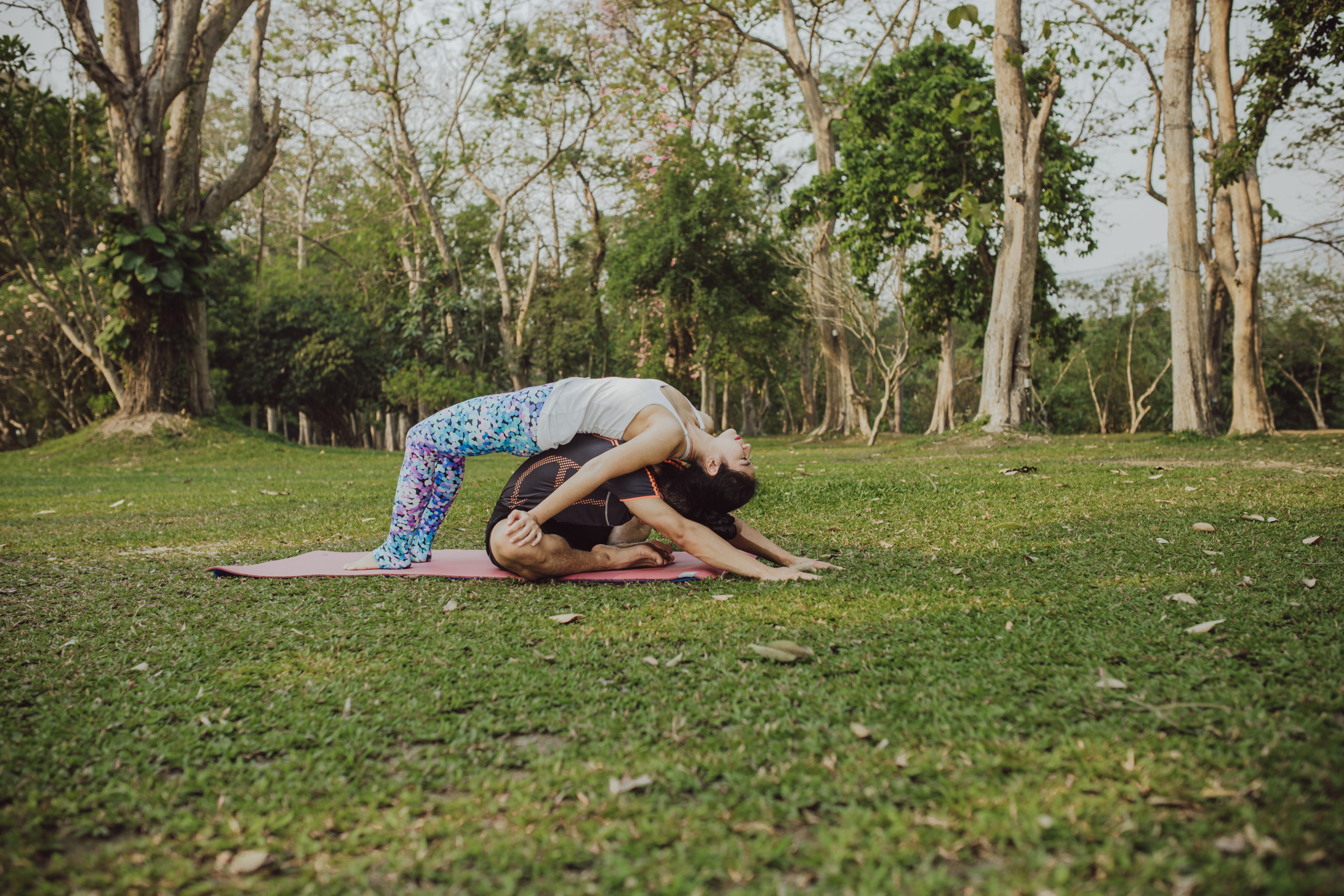 man-woman-practising-yoga-park.jpg