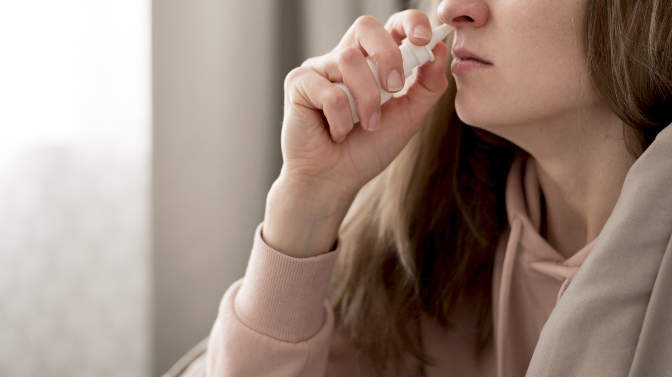 close-up-woman-taking-treatment-for-runny-nose.jpg