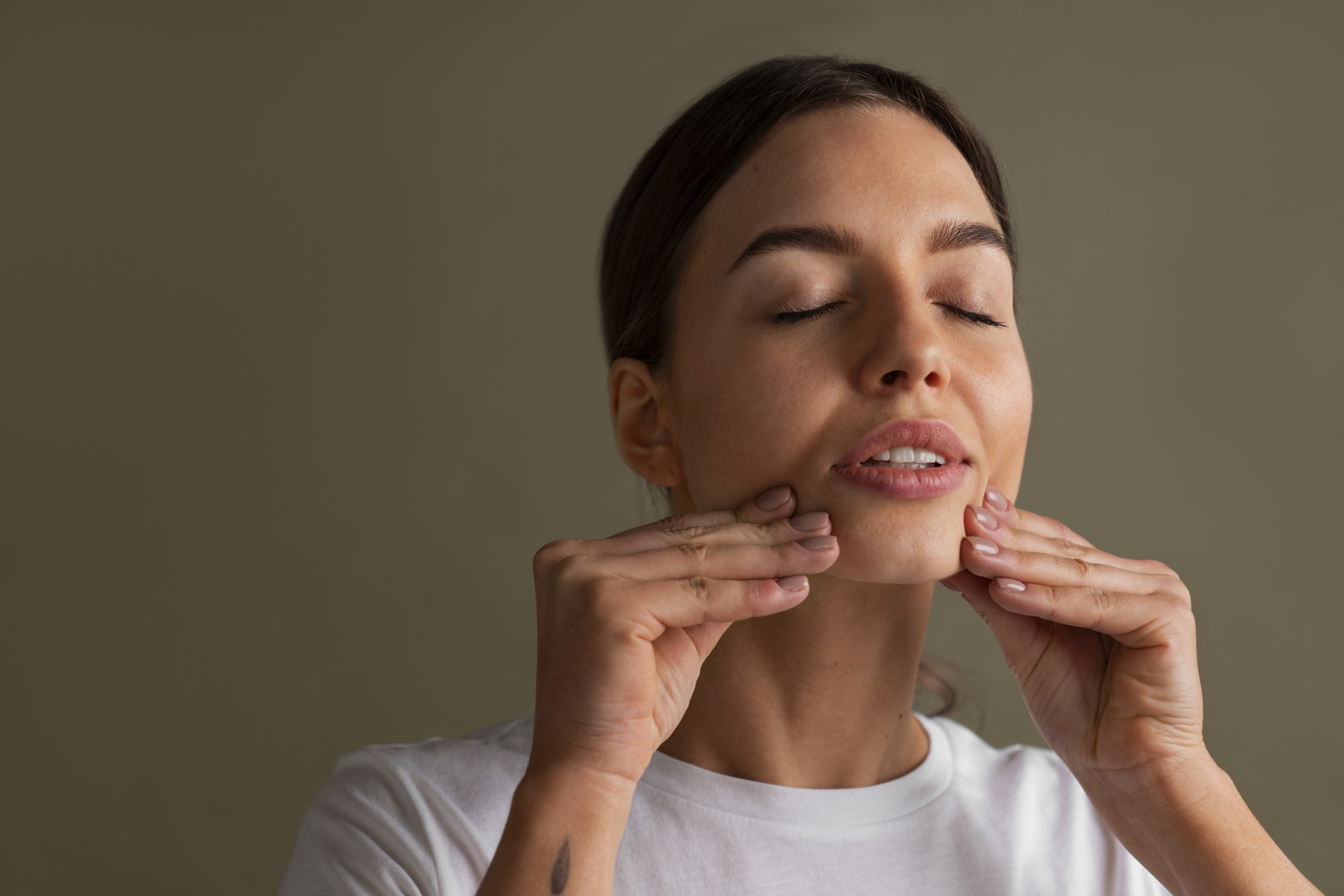 portrait-young-woman-practicing-facial-yoga-youth (4).jpg