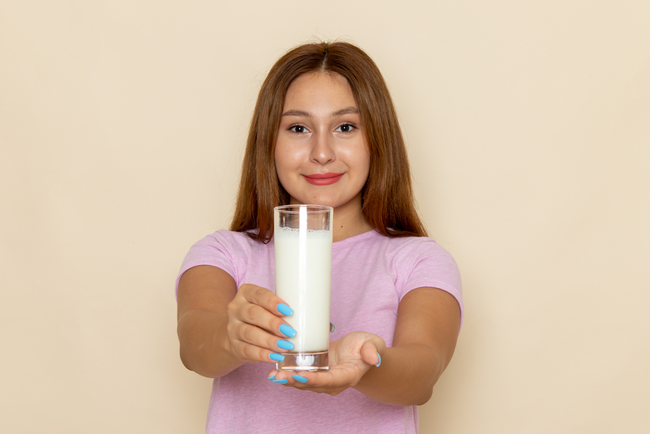 front-view-young-attractive-female-pink-t-shirt-blue-jeans-holding-milk.jpg