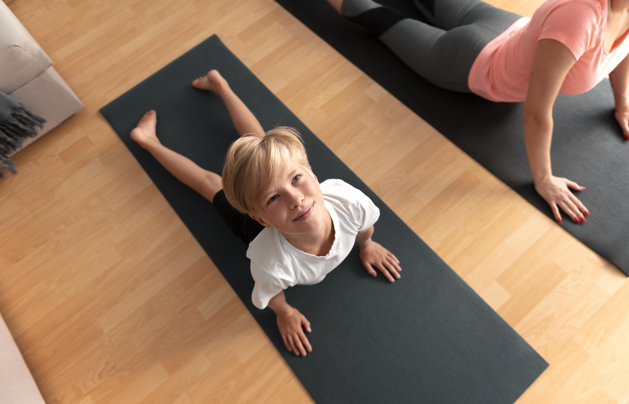 close-up-kid-woman-with-yoga-mats.jpg