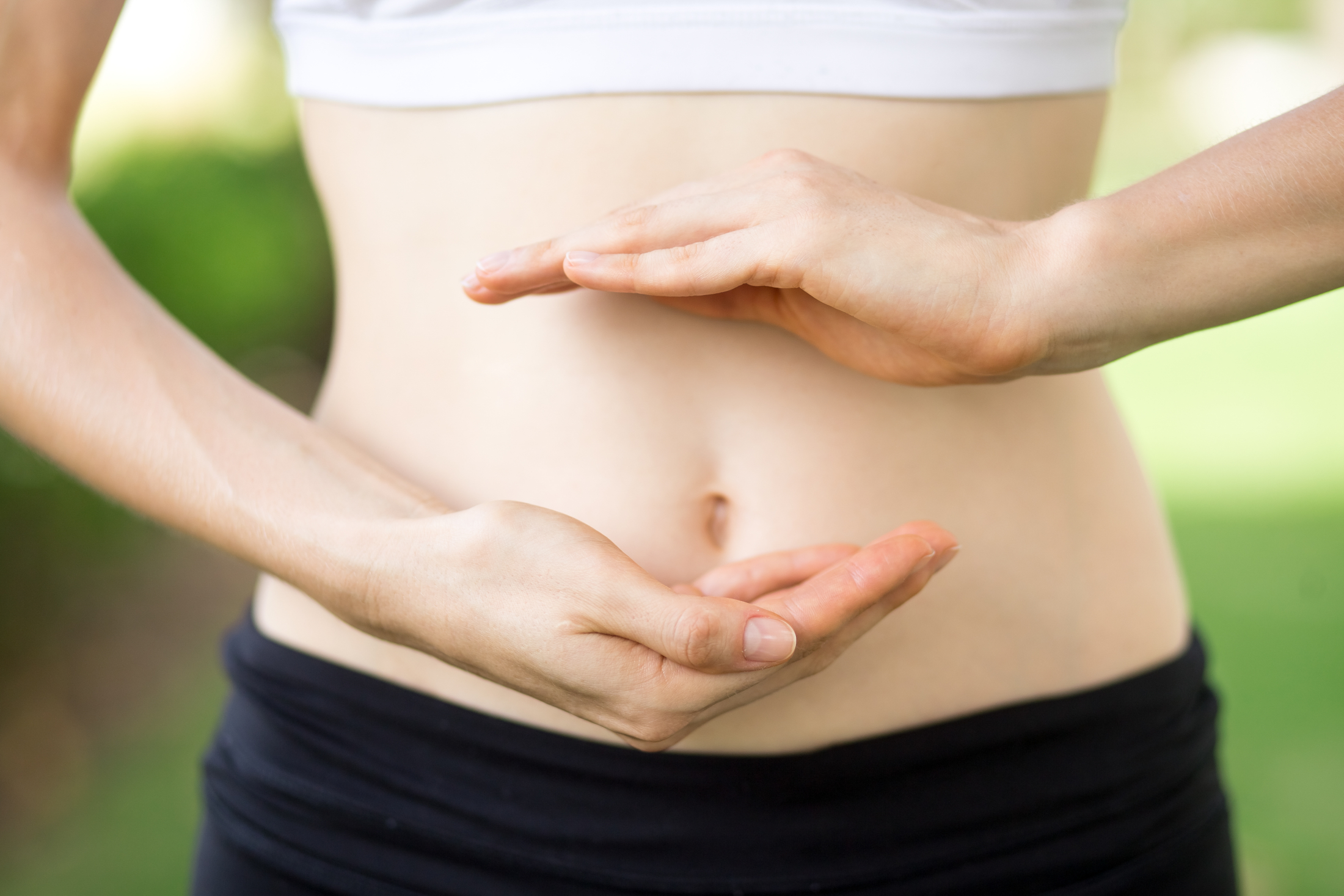 close-up-young-womans-hands-slim-belly.jpg