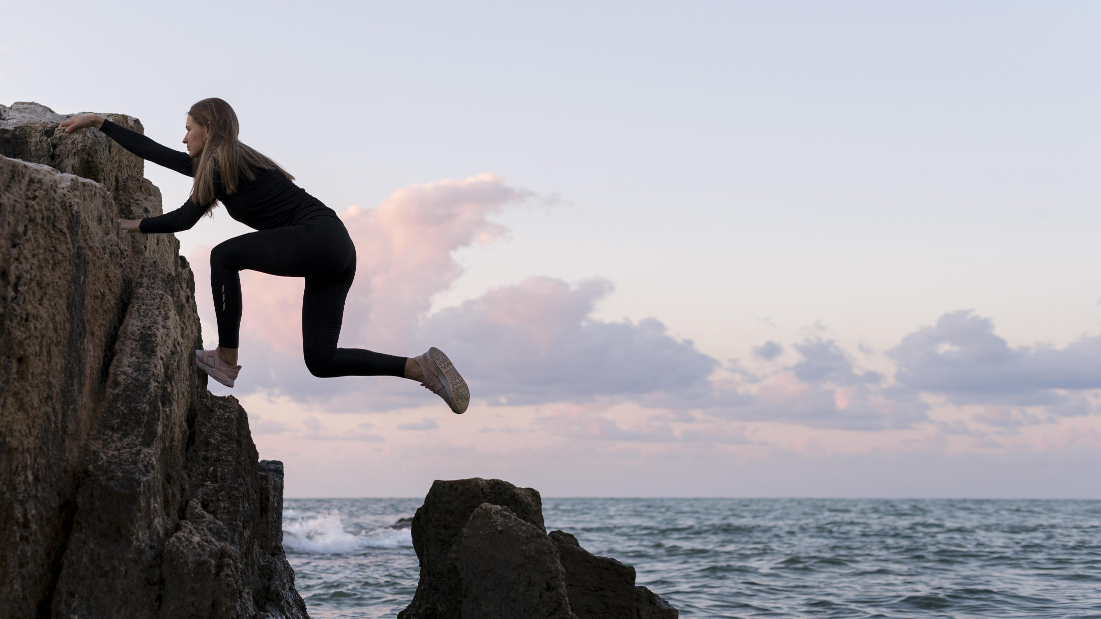 side-view-woman-climbing-coast.jpg