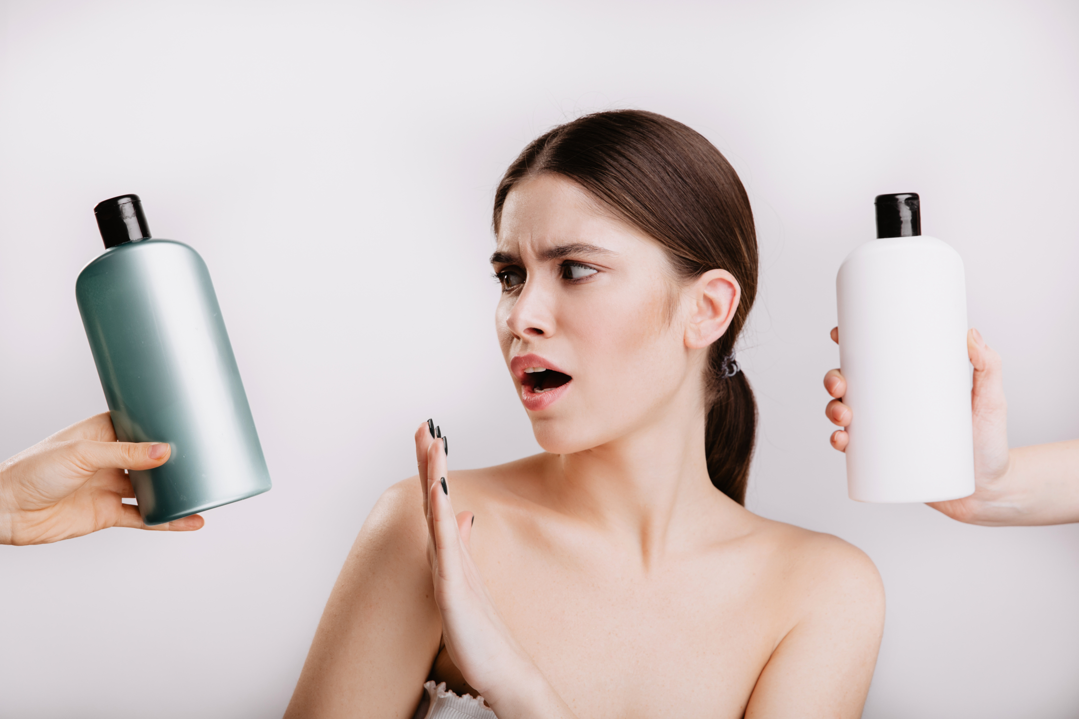 snapshot-of-beautiful-lady-on-white-wall-girl-refuses-to-use-shampoo-with-chemicals-in-favor-of-natural.jpg