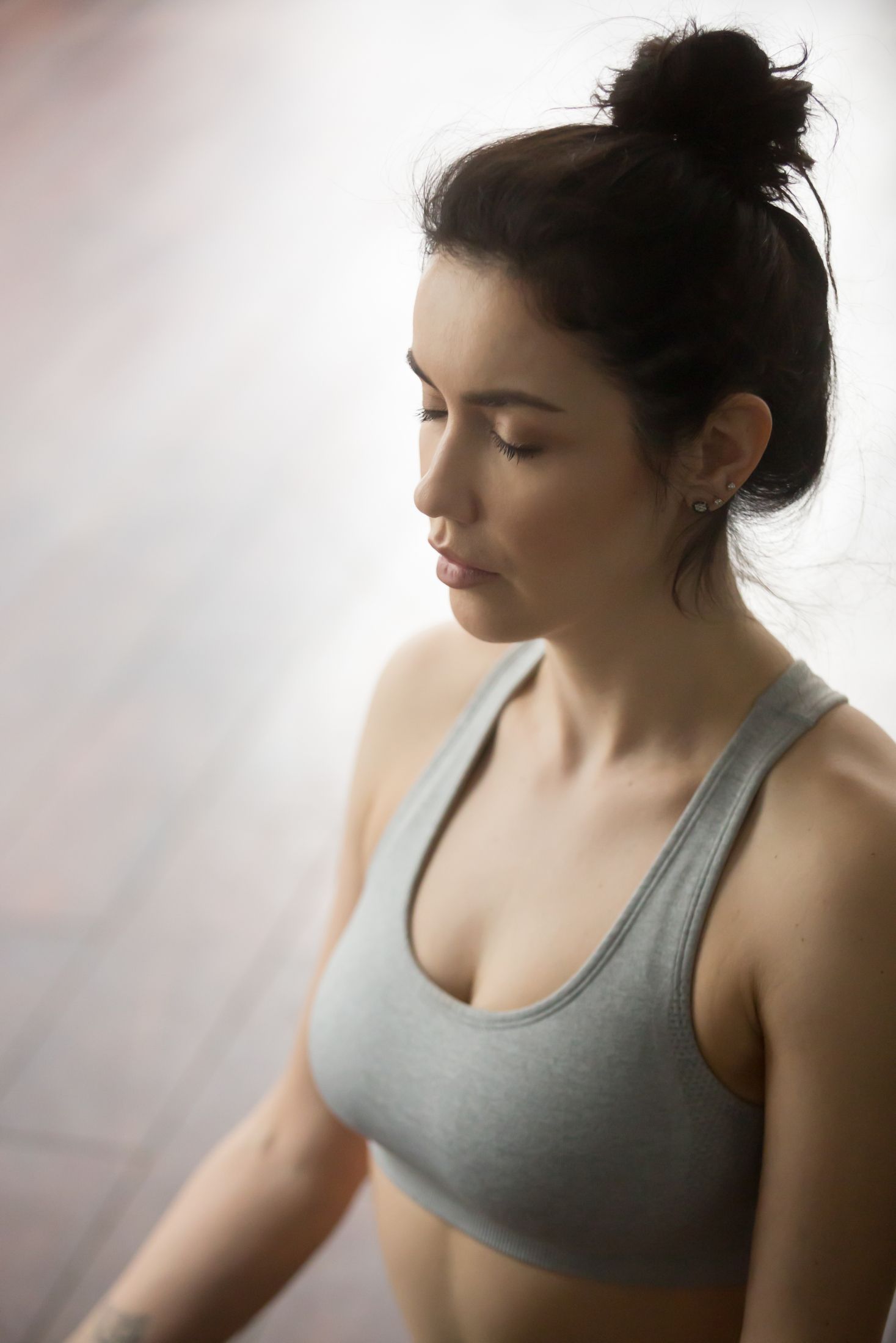portrait-of-young-attractive-woman-meditating-in-yoga-pose.jpg