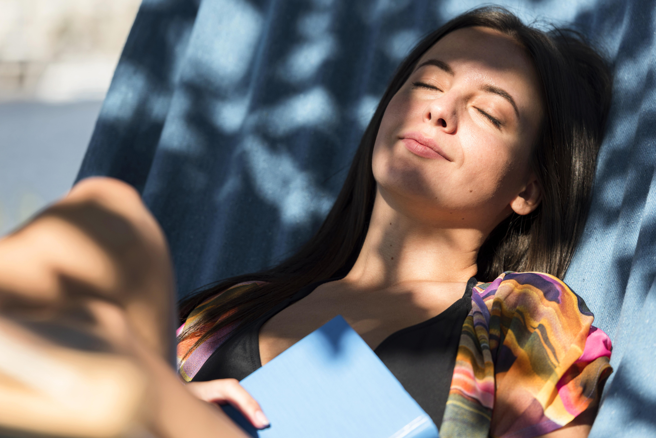 woman-relaxing-hammock-while-beach-with-book (2).jpg