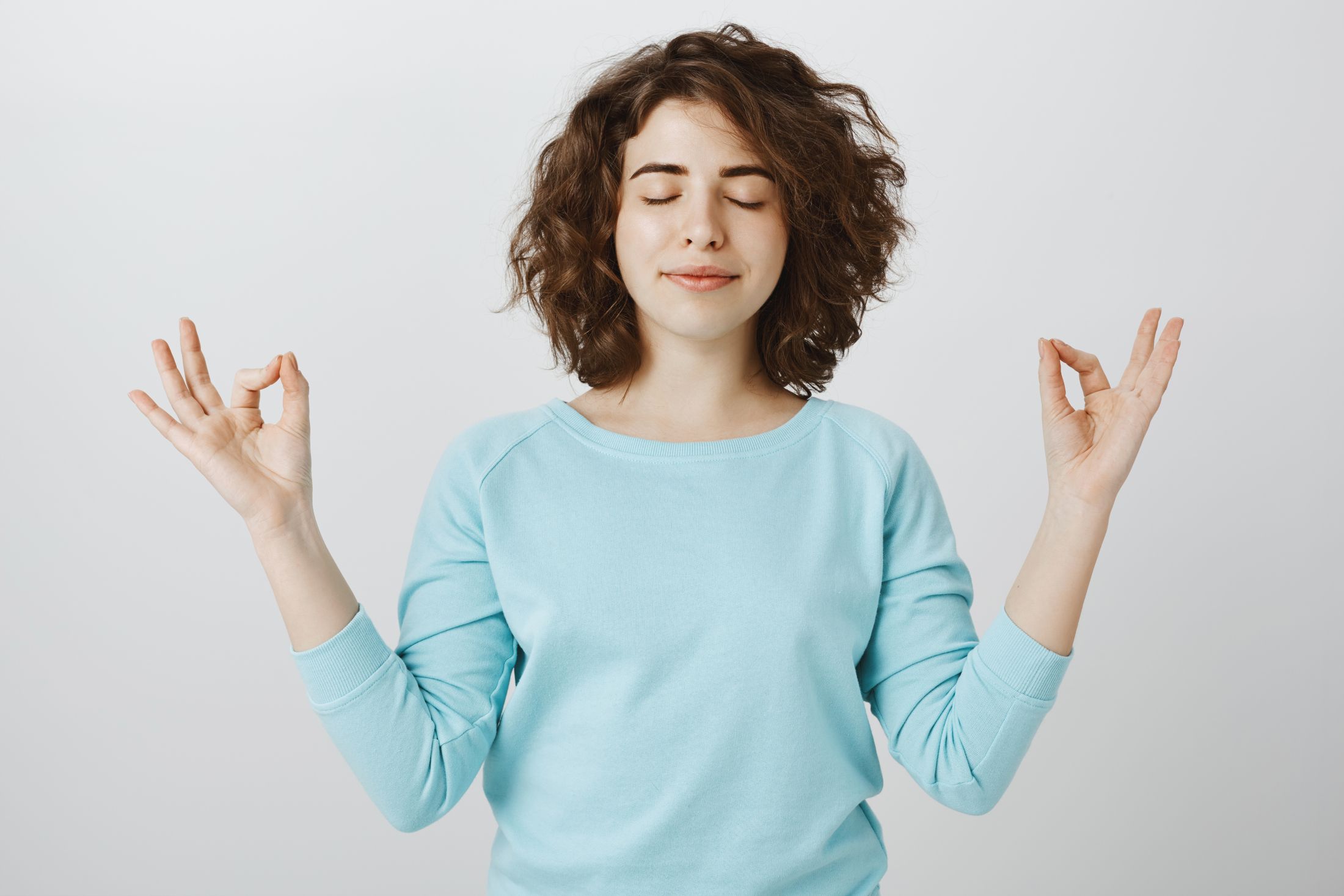 peaceful-relaxed-smiling-woman-with-closed-eyes-meditating-find-nirvana.jpg