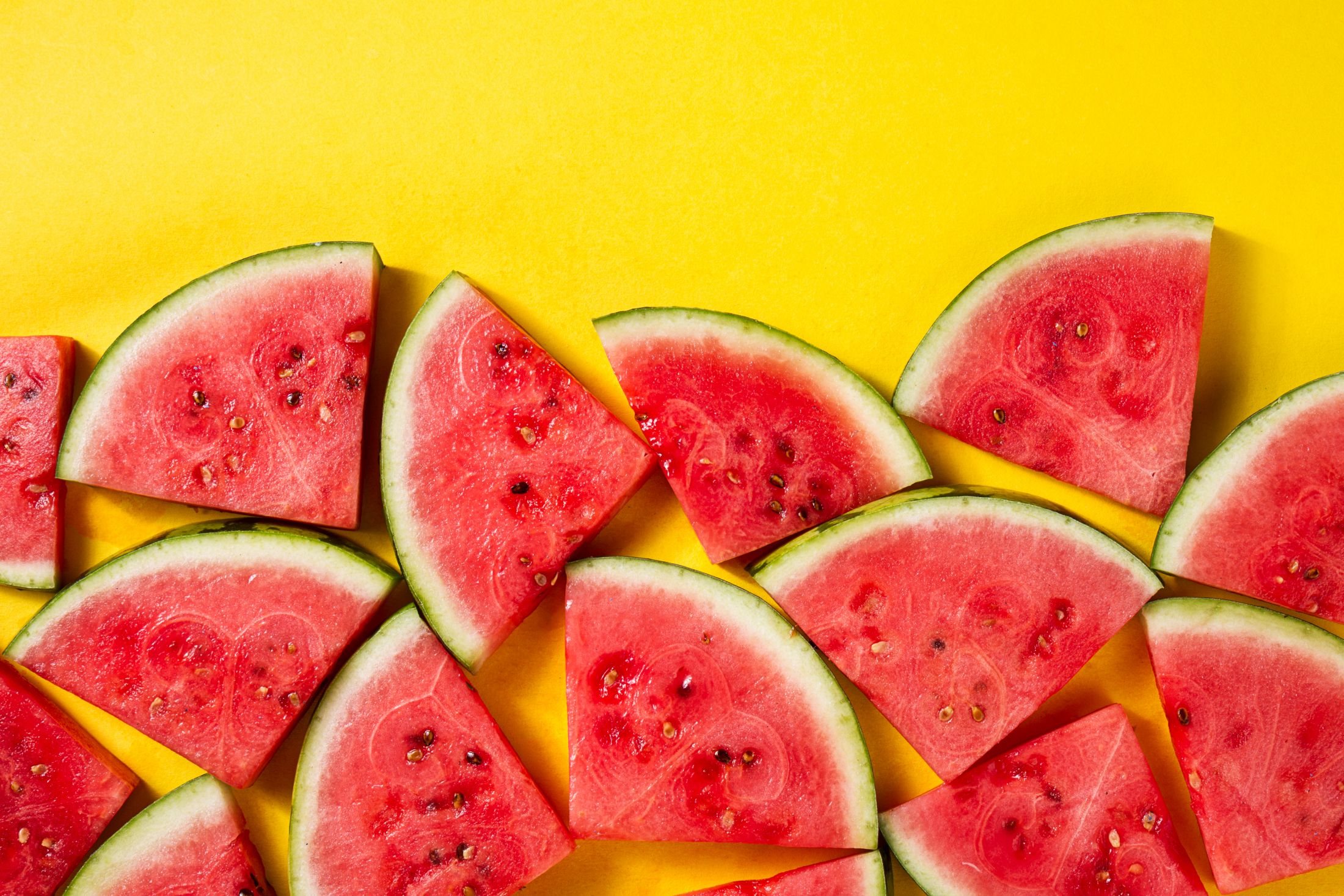 beautiful-pattern-with-fresh-watermelon-slices-on-yellow-bright-background-top-view-copy-space.jpg
