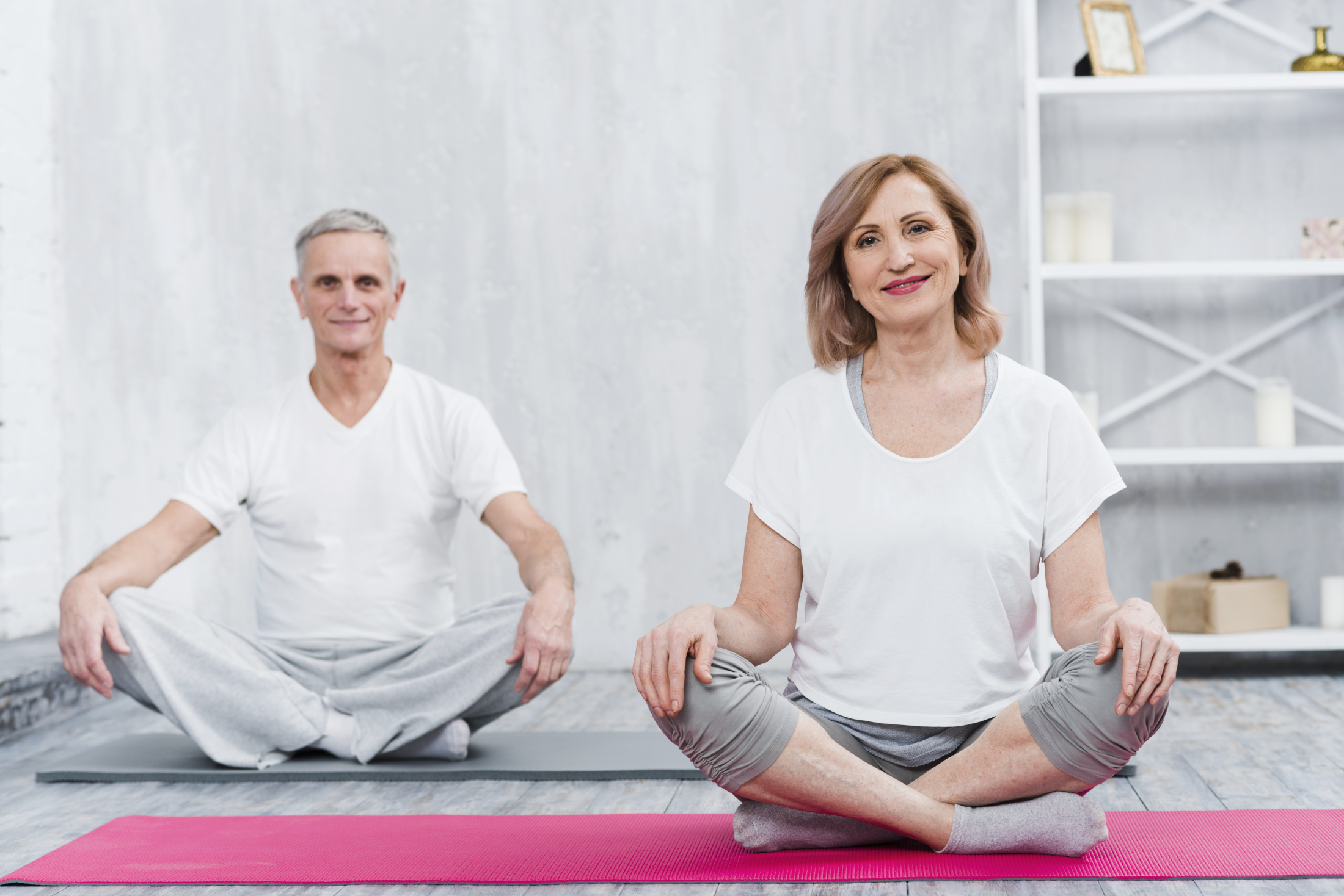 happy-couple-sitting-home-yoga-mat.jpg