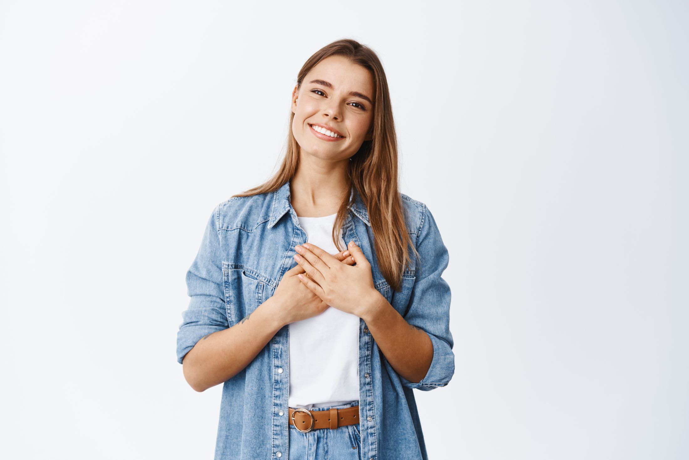 portrait-touched-young-woman-feeling-flattered-holding-hands-heart-smiling-white-teeth-say-thank-you-appreciate-help-being-grateful-nice-gesture-white.jpg