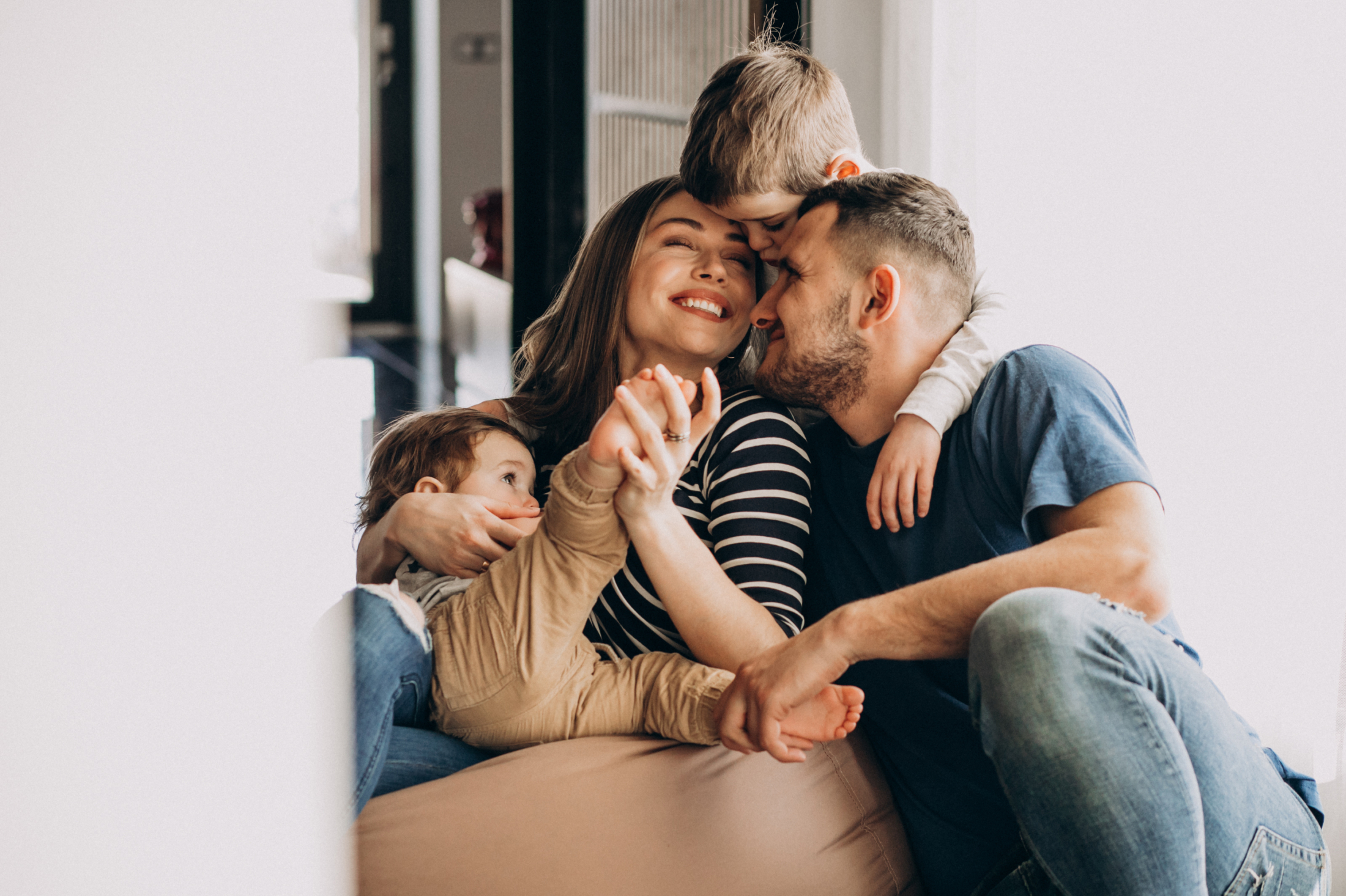 young-family-with-their-sons-home-having-fun.jpg