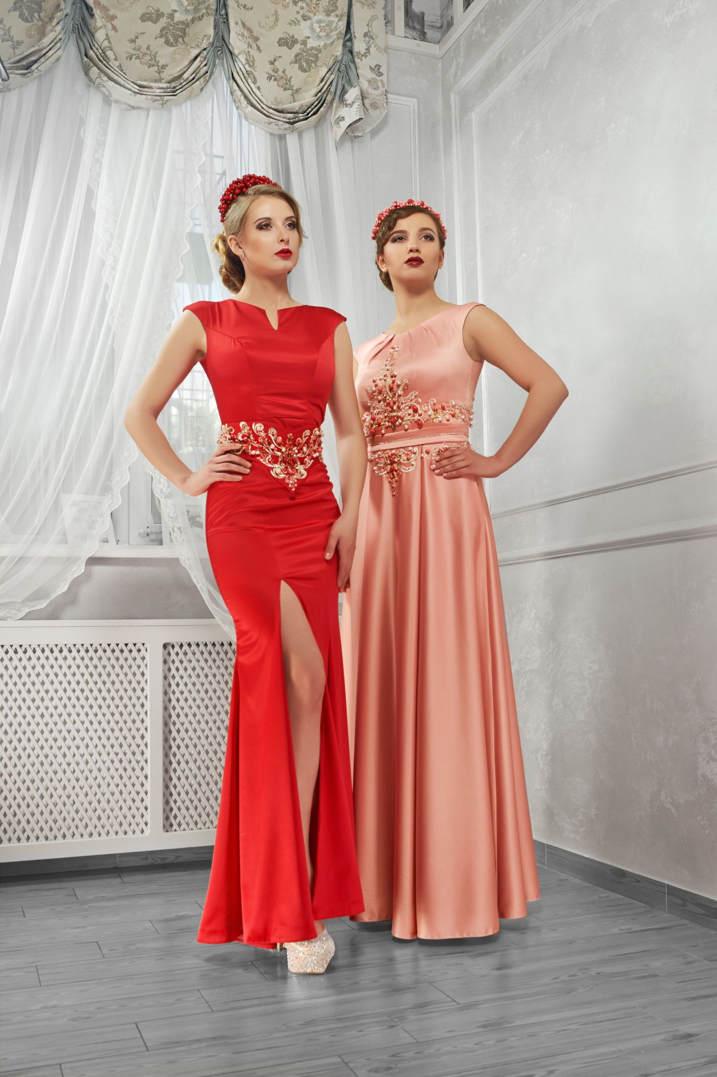 two-young-beautiful-women-in-long-evening-red-and-peach-dresse.jpg